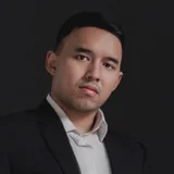 Adjie Brotosukmono in a dark suit and white shirt
